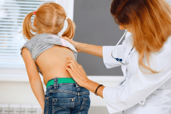 Checking a child for scoliosis